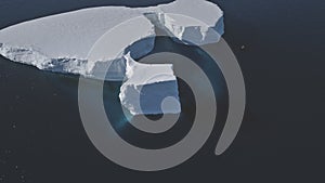 Tabular iceberg float antarctic clear water aerial photo