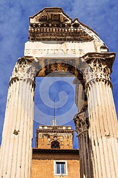 The Tabularium building peeking through the columns of the Temple of Vespasian and Titus, Roman Forum