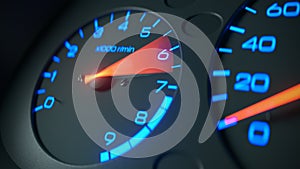 Tachometer in blue and with a red arrow on the car dashboard 3D