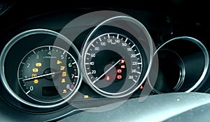 Tachometer with glowing needle indicate engine revolutions and zero speed