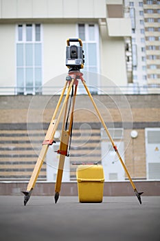 Tachometer on pavement in front of a photo