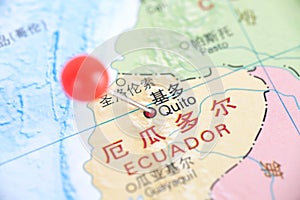 The tack marked the location of Quito, the capital of Ecuador, on the map