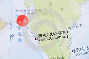 Tack marks the location of Reykjavik, the capital of Greenland, on the map