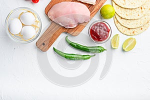 Taco ingredients homemade authentic mexican meal, over white concrete background top view with space for text