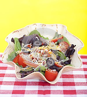 Taco salad on checkered tablecloth