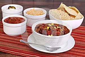 Taco Soup with assorted condiments photo