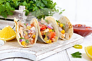 Taco - wheat tortilla with meat, vegetables, corn, greens. Delicious mexican snack