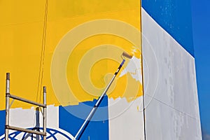 Tacoma, WA, USA, October, 23-25, 2019. Repainting the shipÃ¢â¬â¢s funnel and drawing the logo of the shipowner with m