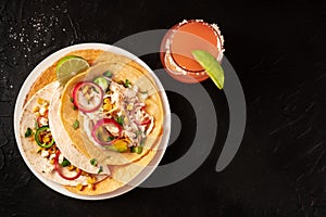 Tacos with chicken and avocado, with a Paloma cocktail