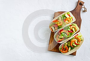 Tacos with shrimp, avocado and salad. Mexican food