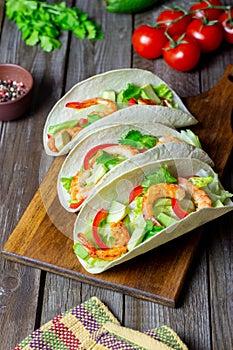 Tacos with shrimp, avocado and salad. Mexican food