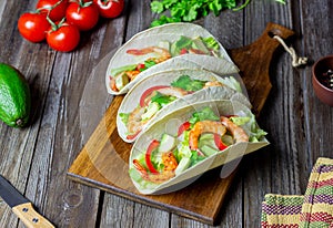 Tacos with shrimp, avocado and salad. Mexican food