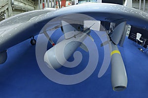 Tactical air-to-ground missiles set on the military unmanned aerial vehicle placed on a stand