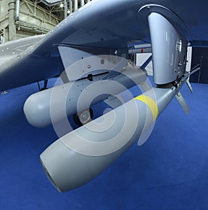 Tactical air-to-ground missiles set on the military unmanned aerial vehicle placed on a stand