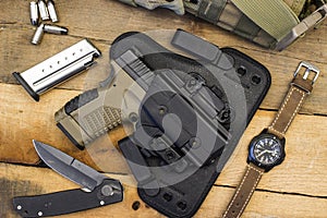Tactical Handgun and Gear including Watch, Bullets, Knife, Holster, Bag