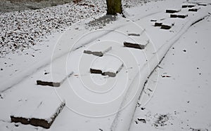 Tactile path for bare feet awakens the senses and uneven endings on the feet alternating different materials wood stone gravel san