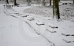 Tactile path for bare feet awakens the senses and uneven endings on the feet alternating different materials wood stone gravel san