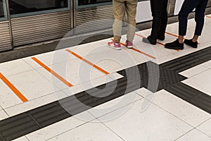 Tactile paving foot path for the blind subway station photo