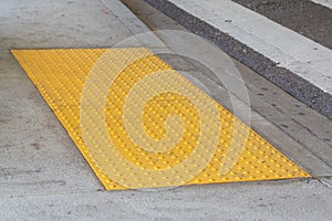 Tactile paving with textured ground surface with markings, indicators for blind