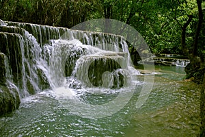 tad kuang si one of beautiful limestone waterfall in luangprabang one of most popular attraction in northern of lao photo