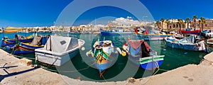 Taditional eyed boats Luzzu in Marsaxlokk, Malta photo