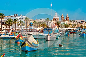 Taditional eyed boats Luzzu in Marsaxlokk, Malta photo