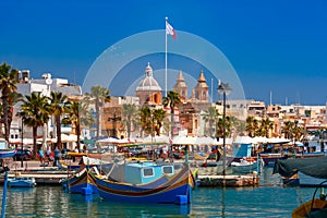 Taditional eyed boats Luzzu in Marsaxlokk, Malta photo