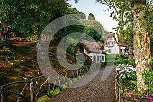 Taditional houses in Queimadas Forest Park in Santana, Madeira near Caldeirao Verde waterfall, Portugal