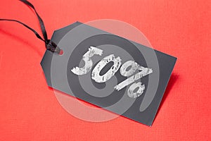 Tag with 50 off for Black Friday or sale action in shop on the red background. Discount sticker template