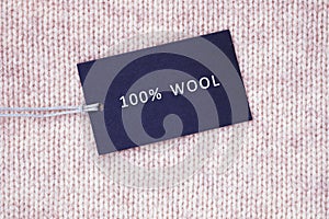 Tag composition of clothing on knitted texture background