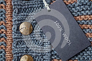 Tag composition of clothing on knitted texture background