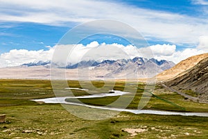 Tagharma viewing deck panorama on Pamir Plateau, at the feet of Muztagh Ata, China.