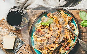 Tagliatelle bolognese with minced meat, tomato sauce and parmesan cheese