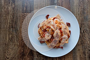 Tagliatelle pasta with sundry tomato and shrimps