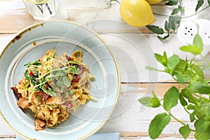 Tagliatelle with salmon and sun-dried tomatoes. Appetizing dish. Top view