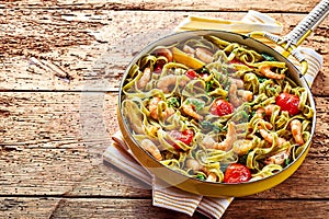 Tagliatelle seafood pasta with prawns and spinach