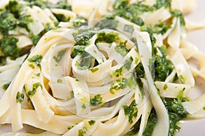 Tagliatelle with spinach on plate