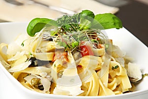 Tagliatelle on table photo