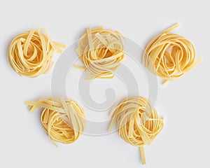 tagliatelli pasta on white