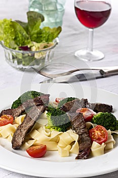 Tagliatelli with steak photo