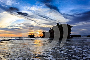 Tahah Lot Temple and ocean waves at sunset, Bali