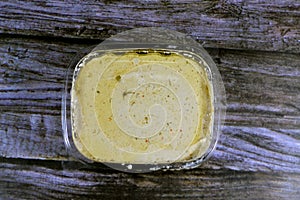 Tahini Tahina which is a Middle Eastern condiment made from toasted ground hulled sesame, served by itself (as a dip)