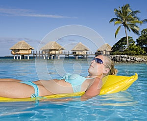 Tahiti - Girl on an airbed photo