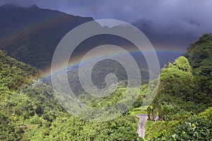 Tahiti. Polynesia. Clouds over a mountain landscape and rainbow