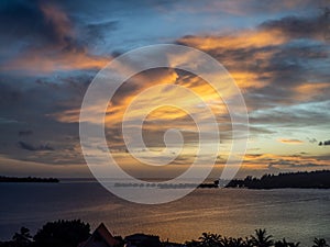 Tahiti resort overwater huts colorful sunset, villas and bungalow, French Polynesia