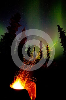 Taiga firepit camp fire sparks and northern lights