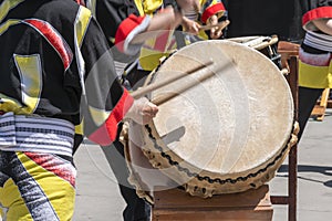 Taiko drummers perform on stage