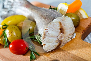 Tail of hake by rustically frying and served with boiled potatoes and tomatoes