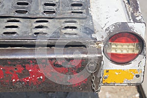 Tail light on an old construction equipment trailer.