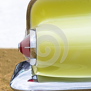 Tail light of a retro american muscle car from the fifties